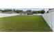 A large, fenced backyard with lawn, brick patio, and screened in porch at 4531 Se 27Th St, Ocala, FL 34480