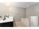 Bathroom boasting a double sink vanity and a separate soaking tub at 4531 Se 27Th St, Ocala, FL 34480