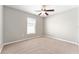 Bedroom with neutral carpet, ceiling fan and natural light from a window at 4531 Se 27Th St, Ocala, FL 34480