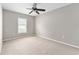 Bedroom with neutral carpet, ceiling fan and natural light from a window at 4531 Se 27Th St, Ocala, FL 34480
