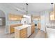 An open kitchen featuring an island with a sink and ample counter space for meal preparation and dining at 4531 Se 27Th St, Ocala, FL 34480