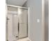 Bathroom featuring glass shower doors and white tile at 4531 Se 27Th St, Ocala, FL 34480
