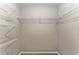 Walk-in closet with white wire shelving system, providing ample storage space at 4531 Se 27Th St, Ocala, FL 34480