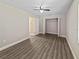 Open bedroom with closet featuring wire shelving and vinyl flooring at 5 Bahia Circle Pl, Ocala, FL 34472