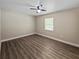 Bedroom with vinyl flooring, ceiling fan, and a bright window at 5 Bahia Circle Pl, Ocala, FL 34472