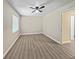 Bedroom featuring vinyl wood-look floors and a window at 5 Bahia Circle Pl, Ocala, FL 34472