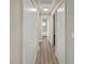 Hallway with closet space and a bathroom featuring a tub and shower at 5 Bahia Circle Pl, Ocala, FL 34472