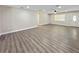 Bright living room featuring sleek floors, neutral walls, ceiling fan, and natural light at 5 Bahia Circle Pl, Ocala, FL 34472