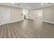 Open-concept living room showcasing sleek floors and access to the modern kitchen at 5 Bahia Circle Pl, Ocala, FL 34472
