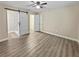 Large main bedroom features modern flooring, and barn door entry into the shower at 5 Bahia Circle Pl, Ocala, FL 34472