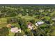 Beautiful aerial view of sprawling community with well manicured landscaping and a golf course at 5034 Nw 75Th Ave, Ocala, FL 34482