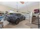 Two-car garage with plenty of room for storage and a door leading to the interior of the home at 5034 Nw 75Th Ave, Ocala, FL 34482