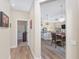 Open hallway view to the kitchen and dining area, showcasing the seamless living space at 5034 Nw 75Th Ave, Ocala, FL 34482