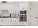 Bright kitchen with stainless steel appliances, granite countertops and custom white cabinets at 5034 Nw 75Th Ave, Ocala, FL 34482