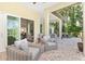 Spacious covered patio offering multiple seating areas and seamless access to the indoors at 5034 Nw 75Th Ave, Ocala, FL 34482