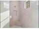 The tiled shower has a built-in seat and niche, enhancing this modern bathroom's elegance at 5034 Nw 75Th Ave, Ocala, FL 34482