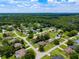 Expansive aerial view of the neighborhood's mature trees, green lawns, and beautifully maintained homes at 5390 Se 15Th Ct, Ocala, FL 34480