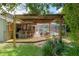 Backyard featuring bar and pergola with view of patio and pool at 5390 Se 15Th Ct, Ocala, FL 34480