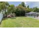 Large backyard featuring a playset and a spacious grass area for recreational activities at 5390 Se 15Th Ct, Ocala, FL 34480