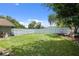 Large backyard with well manicured grass and play area at 5390 Se 15Th Ct, Ocala, FL 34480