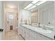 Bathroom with double sinks and decor at 5390 Se 15Th Ct, Ocala, FL 34480