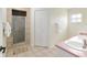 Clean bathroom with dual sinks, tiled shower, and ample storage space at 5390 Se 15Th Ct, Ocala, FL 34480