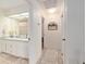 Bathroom with double sinks, decor, and tile flooring at 5390 Se 15Th Ct, Ocala, FL 34480