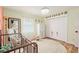 A cozy ' bedroom features a large round rug at 5390 Se 15Th Ct, Ocala, FL 34480