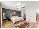Cozy bedroom with a decorative rug, statement wall, and wooden accents for a warm ambiance at 5390 Se 15Th Ct, Ocala, FL 34480