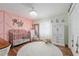 Charming Bedroom features a decorative accent wall and modern lighting at 5390 Se 15Th Ct, Ocala, FL 34480
