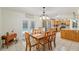 Dining room with backyard pool view and seamless flow into the kitchen at 5390 Se 15Th Ct, Ocala, FL 34480