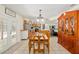 Open-concept dining room leading to the kitchen and living area with seamless flow at 5390 Se 15Th Ct, Ocala, FL 34480