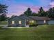 Charming single-story home features a well-manicured lawn, professional landscaping and a welcoming entrance at 5390 Se 15Th Ct, Ocala, FL 34480