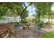 Backyard with a stone fire pit and seating area at 5390 Se 15Th Ct, Ocala, FL 34480