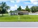 Charming home with a green lawn and mature trees in a quiet suburban neighborhood at 5390 Se 15Th Ct, Ocala, FL 34480