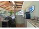Outdoor kitchen with grill, mini-fridge, and sink - perfect for al fresco dining at 5390 Se 15Th Ct, Ocala, FL 34480