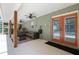 Inviting covered patio with comfortable seating, ceiling fans, and easy access to the pool at 5390 Se 15Th Ct, Ocala, FL 34480