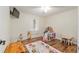 Bright playroom features a ceiling fan and lots of toys at 5390 Se 15Th Ct, Ocala, FL 34480
