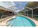 Inviting screened pool with clear water and a nice grassy backyard, perfect for outdoor entertainment at 5390 Se 15Th Ct, Ocala, FL 34480