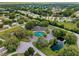An aerial view of the community center, with a pond and lush green landscaping, surrounded by homes at 6495 Sw 109Th St, Ocala, FL 34476
