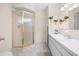 Bathroom with a gold-trimmed corner shower and neutral-toned vanity at 6495 Sw 109Th St, Ocala, FL 34476