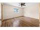 A spacious bedroom with wood floors and a window at 6495 Sw 109Th St, Ocala, FL 34476