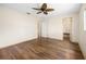 Bright bedroom with hardwood floors and open doorways at 6495 Sw 109Th St, Ocala, FL 34476
