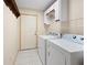 Laundry room with washer, dryer, and storage cabinets at 6495 Sw 109Th St, Ocala, FL 34476