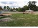 Spacious fenced backyard with a storage shed and a deck, perfect for outdoor activities at 7 Pecan Drive Loop, Ocala, FL 34472