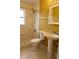Bathroom features a walk-in shower, pedestal sink, neutral color scheme, and is well-lit at 7 Pecan Drive Loop, Ocala, FL 34472
