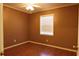 Bedroom with hardwood floors, ceiling fan, and a window providing natural light offers a cozy atmosphere at 7 Pecan Drive Loop, Ocala, FL 34472