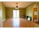 Spacious living area with sliding glass doors, ceiling fan, neutral tones, and tile floors, offers great natural light at 7 Pecan Drive Loop, Ocala, FL 34472