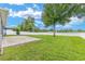 Expansive backyard with a well-maintained lawn and a charming brick patio area at 7054 Sw 64Th Ter, Ocala, FL 34476