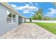 Beautifully landscaped backyard with a covered patio and lush green grass at 7054 Sw 64Th Ter, Ocala, FL 34476